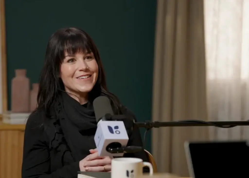 Amber Vaughan speaking on a podcast