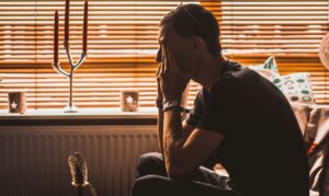 frustrated man sitting in denial,