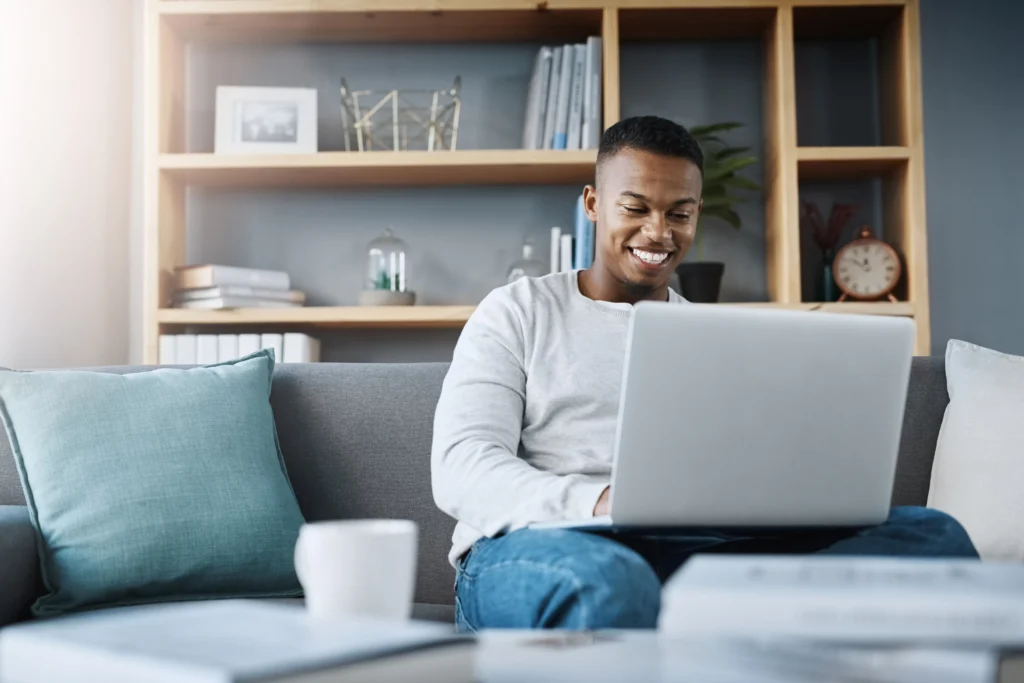 man on his computer attending virtual therapy