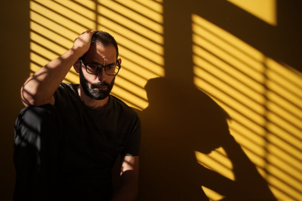 Moody man contemplating