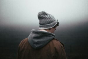 Moody teenager wearing a beanie hat