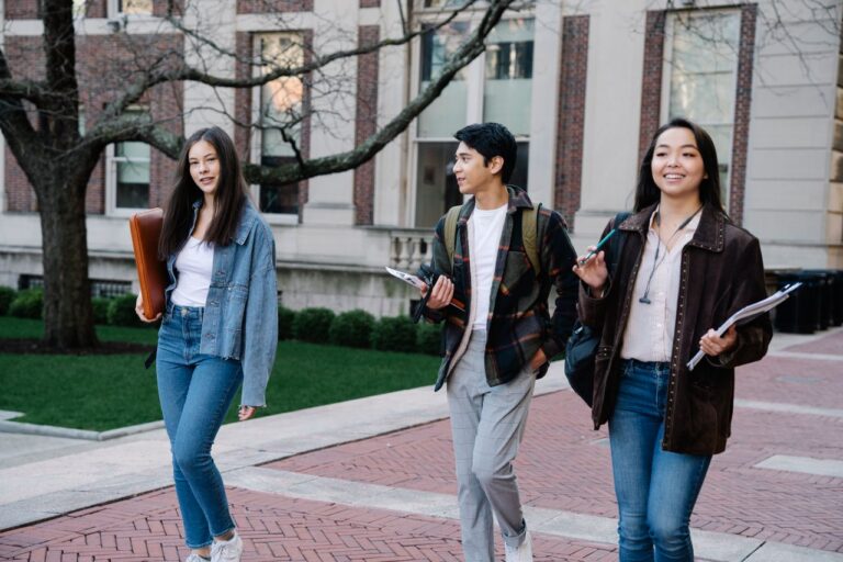 Three teenagers leaving school